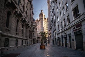 Charming empty street in Santiago, Chile, showcasing classic architecture under a clear sky.