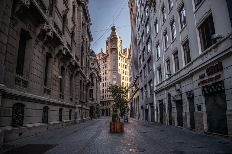 Charming empty street in Santiago, Chile, showcasing classic architecture under a clear sky.