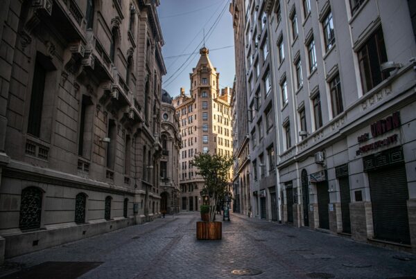 Charming empty street in Santiago, Chile, showcasing classic architecture under a clear sky.